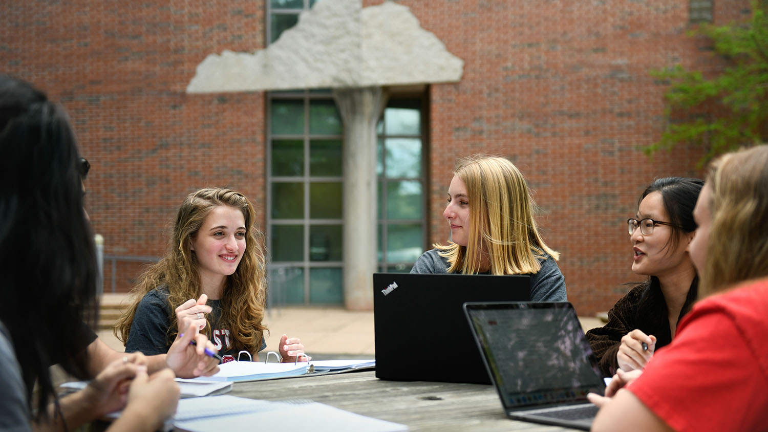 Students outside Jordan Hall at a table  - College of Natural Resources News NC State University